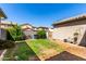 The backyard offers both grassy and dirt areas, plus an enclosed patio at 4068 E Devon Dr, Gilbert, AZ 85296