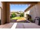 Backyard area with green grass and stone perimeter at 4068 E Devon Dr, Gilbert, AZ 85296