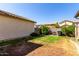 Backyard area with green grass and block fence at 4068 E Devon Dr, Gilbert, AZ 85296
