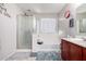 Bathroom featuring shower, bath and vanity with neutral-colored walls at 4068 E Devon Dr, Gilbert, AZ 85296