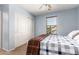 Bedroom with blue walls, a window, and a closet with sliding doors at 4068 E Devon Dr, Gilbert, AZ 85296