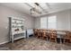 Bright dining room featuring updated lighting, built in shelving, and large table at 4068 E Devon Dr, Gilbert, AZ 85296
