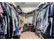 Walk-in closet with ample storage space, including shelving and hanging rods at 4068 E Devon Dr, Gilbert, AZ 85296