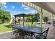 Inviting backyard with covered patio, outdoor seating, fireplace, playset and lush green lawn at 4111 N 52Nd St, Phoenix, AZ 85018