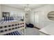 Bright bedroom featuring a bunk bed, closet, and window seat for relaxation and storage at 4111 N 52Nd St, Phoenix, AZ 85018