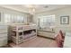 Charming ' bedroom featuring a bunk bed, window nook, and chandelier lighting at 4111 N 52Nd St, Phoenix, AZ 85018