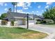 Expansive home with a three-car garage, basketball court, and lush landscaping at 4111 N 52Nd St, Phoenix, AZ 85018