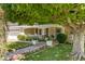 Charming front entrance with a stone pathway lined with colorful flowers at 4111 N 52Nd St, Phoenix, AZ 85018