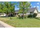 Charming single-story home with a spacious front yard and mature trees at 4111 N 52Nd St, Phoenix, AZ 85018