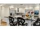 Modern kitchen with stainless steel appliances, granite countertops, and breakfast bar at 4111 N 52Nd St, Phoenix, AZ 85018
