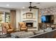 Cozy living room with a brick fireplace, hardwood floors, and comfortable seating at 4111 N 52Nd St, Phoenix, AZ 85018