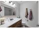 Well-lit bathroom with vanity, updated faucet, and neutral decor at 4418 E Paradise Ln, Phoenix, AZ 85032