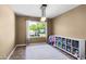 Well-lit bedroom with natural light, a rug, and ample space for storage at 4418 E Paradise Ln, Phoenix, AZ 85032