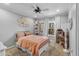 Cozy bedroom featuring a white metal bed frame and a charming dollhouse near the window at 4418 E Paradise Ln, Phoenix, AZ 85032