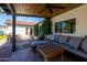 Charming covered patio offers a cozy seating area with a wood ceiling, perfect for relaxing outdoors at 4418 E Paradise Ln, Phoenix, AZ 85032