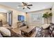 Comfortable living area featuring a leather sofa, media console and a view to the exterior at 4418 E Paradise Ln, Phoenix, AZ 85032