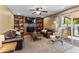 Cozy living room featuring a brick fireplace and built-in bookshelves, perfect for relaxing at 4418 E Paradise Ln, Phoenix, AZ 85032