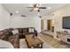 Relaxing living room with a plush leather sofa and rustic wooden coffee table on a rug at 4418 E Paradise Ln, Phoenix, AZ 85032