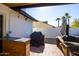 Outdoor patio offers a built-in counter, grill, and seating area perfect for cooking and entertaining at 4418 E Paradise Ln, Phoenix, AZ 85032