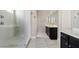 A bright bathroom provides a walk-in shower with dual vanities and modern tile work at 4535 E Navigator Ln, Phoenix, AZ 85050