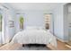 A well-lit primary bedroom boasts a calm color palette, complemented by natural light streaming through the bright windows at 4535 E Navigator Ln, Phoenix, AZ 85050