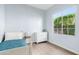 Comfortable bedroom with a twin bed, dresser and a window at 4535 E Navigator Ln, Phoenix, AZ 85050