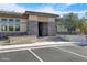 The Sanctuary Clubhouse featuring stone accents, desert landscaping and ample parking at 4535 E Navigator Ln, Phoenix, AZ 85050