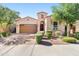 Charming single-story home with a well-manicured front yard and a two-car garage at 4535 E Navigator Ln, Phoenix, AZ 85050