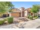 Beautiful single-story home featuring a landscaped front yard and a two-car garage at 4535 E Navigator Ln, Phoenix, AZ 85050