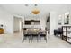 Bright kitchen with a large center island, modern light fixtures and dark wood cabinets provides ample room for cooking and storage at 4535 E Navigator Ln, Phoenix, AZ 85050
