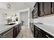Modern kitchen with stainless steel appliances and stylish fixtures, open to living area at 4535 E Navigator Ln, Phoenix, AZ 85050
