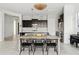 Open-concept kitchen featuring stainless steel appliances, a dining area, and modern lighting at 4535 E Navigator Ln, Phoenix, AZ 85050