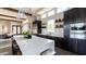 Modern kitchen featuring white countertops, stainless steel appliances, and a large center island with seating at 4535 E Navigator Ln, Phoenix, AZ 85050