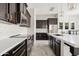 Well-equipped kitchen featuring stainless steel appliances and a marble countertop at 4535 E Navigator Ln, Phoenix, AZ 85050