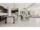 Spacious kitchen with seating area and view into living room with great natural light at 4535 E Navigator Ln, Phoenix, AZ 85050