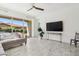 A bright living room provides comfortable seating and backyard views, creating a welcoming atmosphere at 4535 E Navigator Ln, Phoenix, AZ 85050
