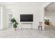 A spacious, light-filled living room offers versatile design, neutral walls and decor, and tiled floors flowing throughout at 4535 E Navigator Ln, Phoenix, AZ 85050