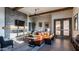 Inviting living room featuring a stone fireplace, wood beam accents, and a cozy seating area at 4535 E Navigator Ln, Phoenix, AZ 85050
