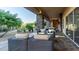 Covered patio featuring comfortable lounge seating and lush landscaping, offering a relaxing outdoor space at 4535 E Navigator Ln, Phoenix, AZ 85050