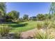 Green park area with shady trees surrounding the community playground at 4535 E Navigator Ln, Phoenix, AZ 85050