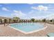 Resort-style pool surrounded by comfortable lounge chairs, covered seating, and well-maintained landscaping at 4535 E Navigator Ln, Phoenix, AZ 85050