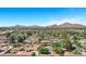 Stunning aerial view of the residential area with views of surrounding mountains at 4634 E Wilshire Dr, Phoenix, AZ 85008
