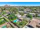 Overhead shot of homes and pools in a suburban neighborhood, providing perspective on community layout at 4634 E Wilshire Dr, Phoenix, AZ 85008