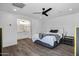 Well-lit bedroom with ensuite bathroom features wood floors and a modern aesthetic at 4634 E Wilshire Dr, Phoenix, AZ 85008