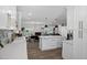 Kitchen with island and breakfast bar open to the dining and living areas at 4634 E Wilshire Dr, Phoenix, AZ 85008