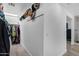 Walk-in closet featuring custom shelving, ample storage space, and a well-organized design at 4634 E Wilshire Dr, Phoenix, AZ 85008
