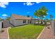 Expansive backyard offers green grass, and an inviting patio area for entertaining and relaxing at 4902 E Golden St, Mesa, AZ 85205