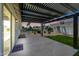 Cozy backyard patio with pergola, view of the pool, tropical landscaping, and sunset at 4902 E Golden St, Mesa, AZ 85205