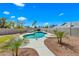 Inviting backyard pool surrounded by lush landscaping under a clear blue sky at 4902 E Golden St, Mesa, AZ 85205