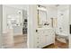 Bright and updated bathroom with modern fixtures, marble countertop, and laminate floors at 4902 E Golden St, Mesa, AZ 85205